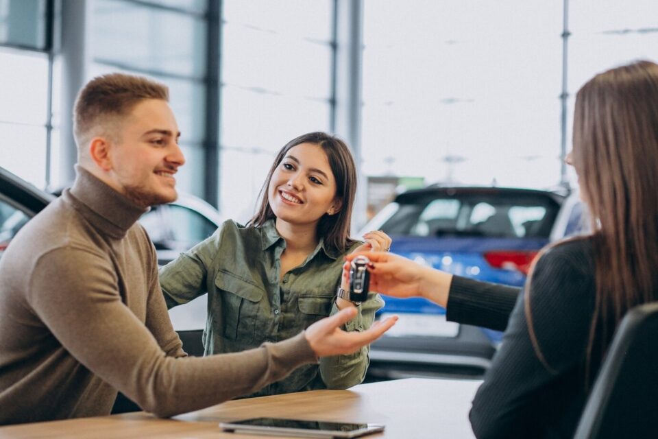 couple buying used car