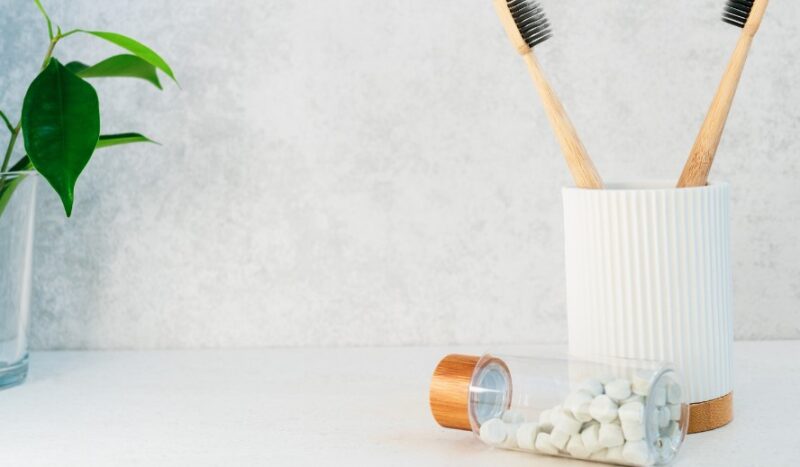 Mouthwash tablets and toothbrush in a bathroom